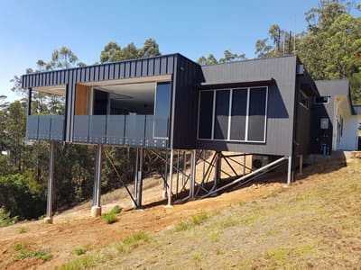 Steep sloping block construction
